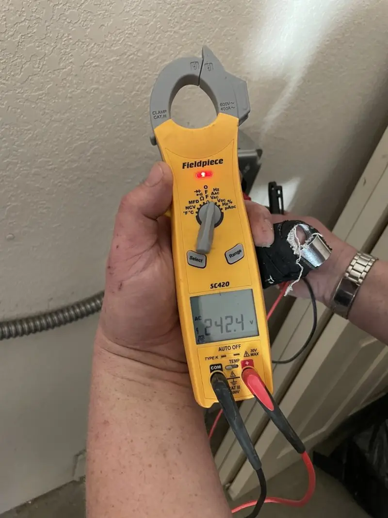 Voltage testing with clamp meter during Electrical Installation Services in Brookhaven